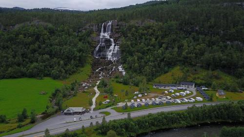 an aerial view of a parking lot with a waterfall at Tvinde Camping in Skulestadmo