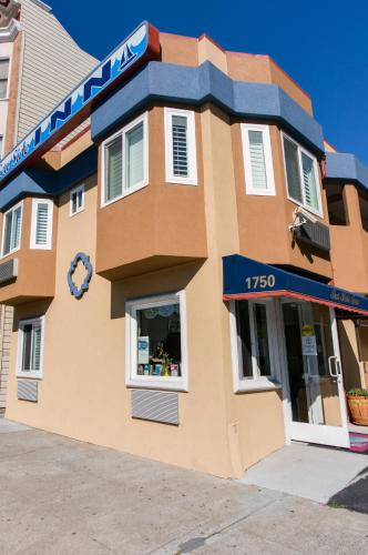 a building with a clock on the side of it at Seaside Inn in San Francisco