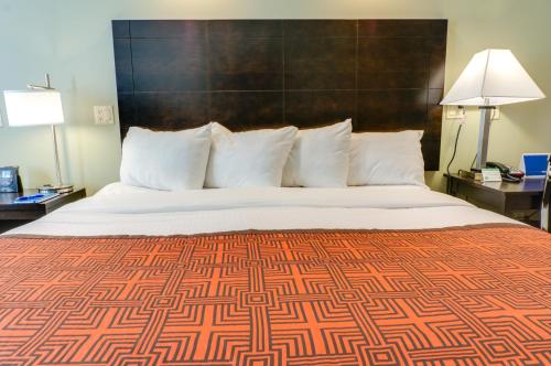 a bedroom with a large bed with a large headboard at Seaside Inn in San Francisco