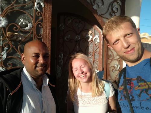 two men and a woman posing for a picture at Habibi Nubian Guest House-Nubian Hospitality in Aswan