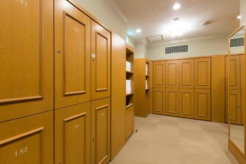 a row of wooden lockers in a locker room at Hotel Monterey Edelhof Sapporo in Sapporo