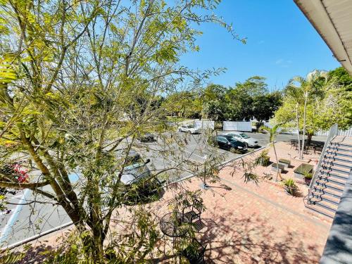 a view of a parking lot with a car parked at Siesta Inn Sarasota - Indian Beach in Sarasota