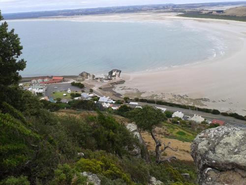 a view of a beach and the ocean at The Ark Stanley Luxury Bed and Breakfast in Stanley