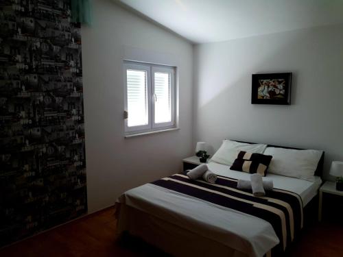 Cama ou camas em um quarto em Apartments Adriapag