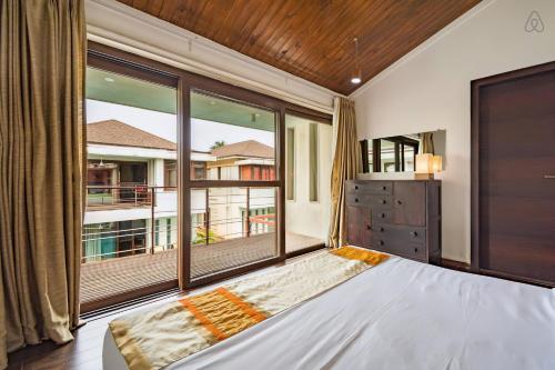 Ένα ή περισσότερα κρεβάτια σε δωμάτιο στο Ochre Villa- Luxury property in Assagaon / Vagator