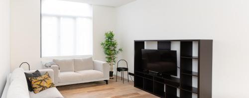Posezení v ubytování Boonuz guesthouse, luxe duplex vakantiehuis in centrum Ieper met privé lounge terras en IR sauna