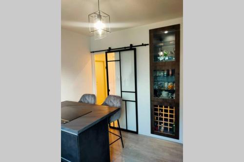 a tasting room with a bar and wine cellar at Logement entier+ jardin privé et parking 2places in Rouen