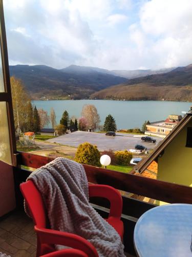 a view of a lake from a balcony at Vila Jezero in Bajina Bašta