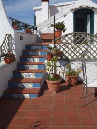 a set of stairs with potted plants on them at Casa Barbara in Amalfi