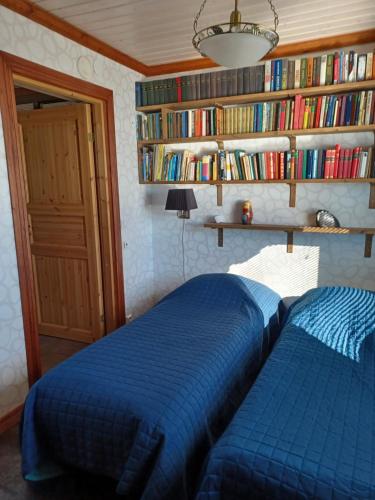 En eller flere senge i et værelse på Villa Vonkale