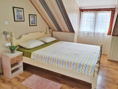 a bedroom with a bed and a window at Apartments Gruda in Cetinje