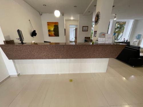 a large counter in a room with a counter top at Hotel Luna Roja del Llano in Yopal