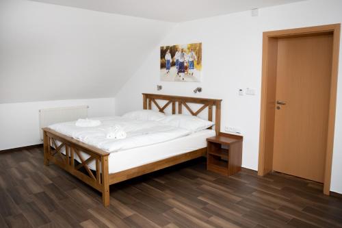 Postel nebo postele na pokoji v ubytování Penzion U Svaťoša