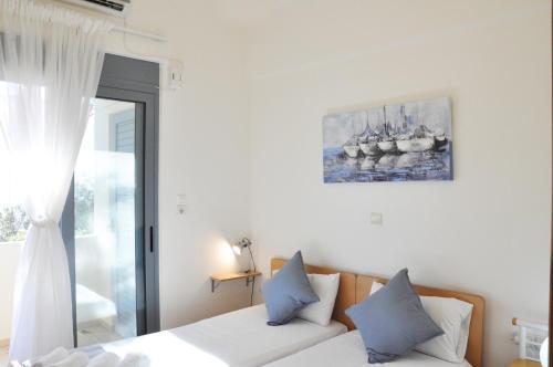 Villa Castellina & Emmanouela holiday apartment tesisinde bir odada yatak veya yataklar