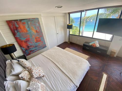 Cama o camas de una habitación en Villa Condesa Del Mar