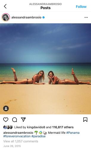 two women laying on the beach near the water at Villa Condesa Del Mar in Contadora