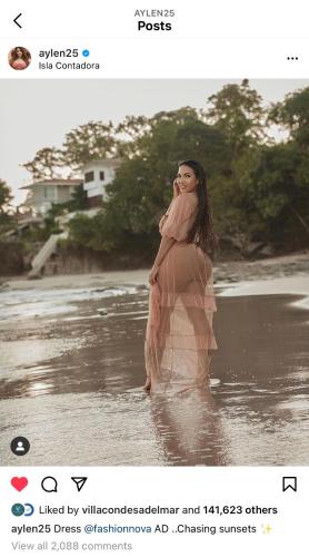 a woman standing in the water on the beach at Villa Condesa Del Mar in Contadora