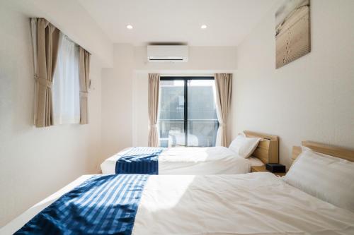 Postel nebo postele na pokoji v ubytování Hotel Emir
