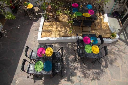 an overhead view of chairs and tables with colorful decorations at PATIO Alojamiento in San Miguel de Allende
