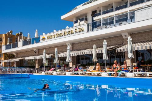 a group of people in the swimming pool at a hotel at White Gold Hotel & Spa in Alanya