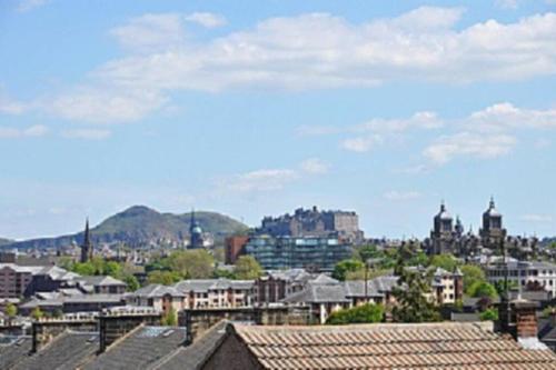 a view of a city with houses and buildings at Sunny House with views to Edinburgh Skyline in Edinburgh