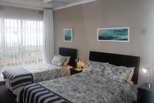 Postel nebo postele na pokoji v ubytování Dolphin View Self Catering