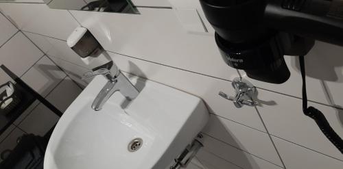 a close up of a toilet in a bathroom at Lux GUEST HOUSЕ МUKACHEVO in Mukacheve