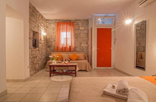 a bedroom with a bed and a red door at Split Inn Apartments in Split