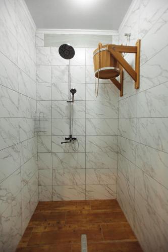 a bathroom with a shower with a shower head at Готель Поляницький in Bukovel