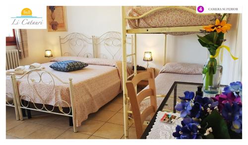 Un pat sau paturi într-o cameră la Li Catauri