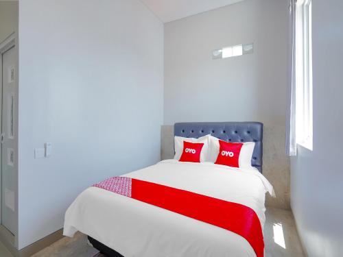 Säng eller sängar i ett rum på Super OYO Capital O 90336 Olive Guest House