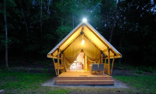 a large yellow tent with a light on top at Глемпінг Шатро in Ulʼyaniki