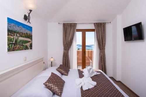 Voodi või voodid majutusasutuse Villa Aria toas