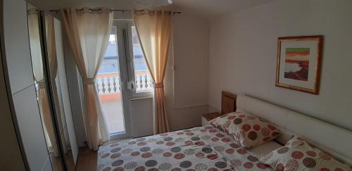 Posteľ alebo postele v izbe v ubytovaní Apartman Jopa