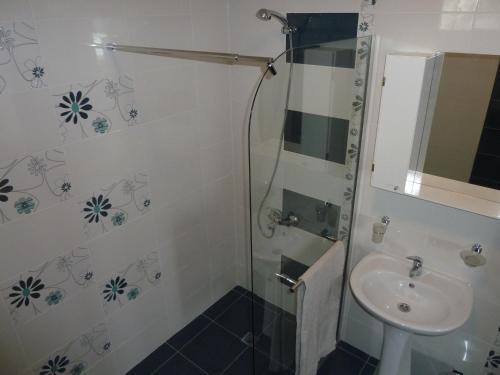 a bathroom with a shower and a sink at Summer Breeze Villa in Balchik