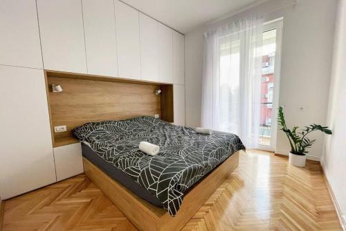 Ένα ή περισσότερα κρεβάτια σε δωμάτιο στο MILLENNIUM bridge cozy apartment TOP location