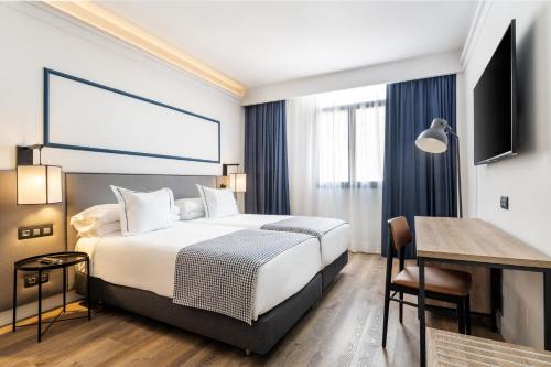 Säng eller sängar i ett rum på Hotel LIVVO Fataga