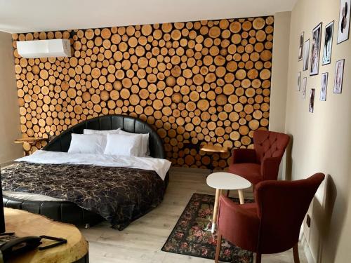 Un pat sau paturi într-o cameră la Grand Altunhan Hotel