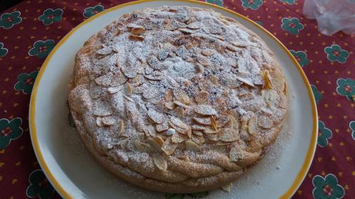 a cake sitting on a plate on a table at B&B Verdeblu in Valderice