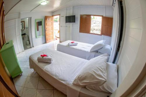 Кровать или кровати в номере Pousada Sol e Mar