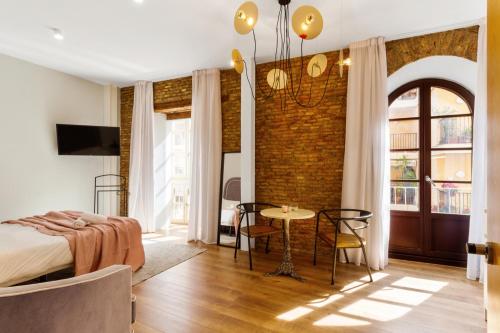 Posteľ alebo postele v izbe v ubytovaní Apartamentos Casapalma Centro Histórico