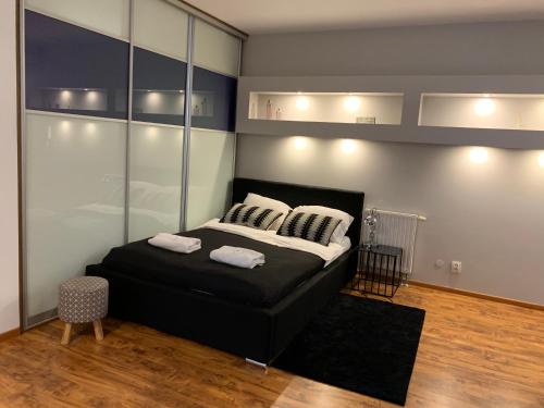 Ein Bett oder Betten in einem Zimmer der Unterkunft Apartamenty AMB Bandurskiego