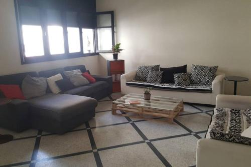 Χώρος καθιστικού στο Chambre mignonne avec petite terrasse