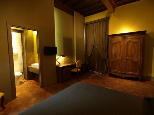 a room with a bedroom with a bed and a bathroom at Le Stanze Del Duomo in Anagni