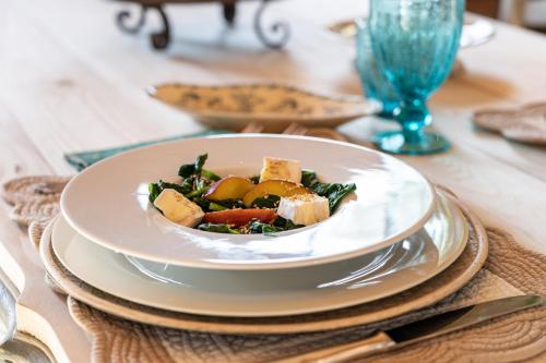 a plate of food on a table with a salad at Agriturismo Poggio Il Castellare in Montalcino