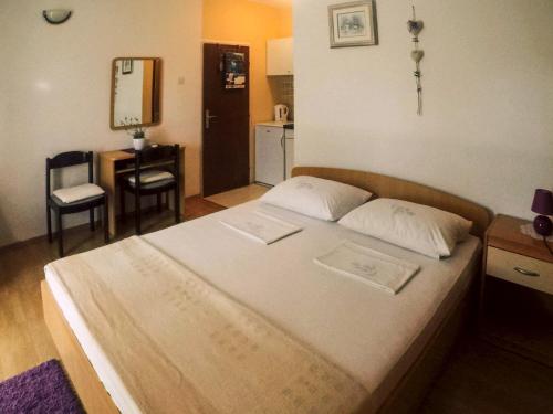 Posteľ alebo postele v izbe v ubytovaní Apartments Milostić