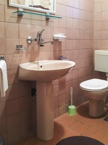 a bathroom with a sink and a toilet at Apartments Milostić Fiskoviceva 30 in Orebić