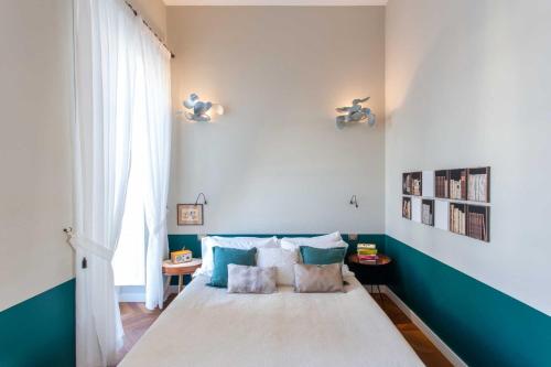 a bedroom with a bed with blue and white walls at Accademia 39 in Sorrento