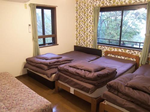 Tempat tidur dalam kamar di Trust Maison Katase - Vacation STAY 24205v