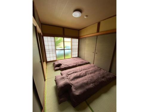 a small room with two beds in it at Trust Maison Hakone Sengokuhara - Vacation STAY 24226v in Sengokuhara